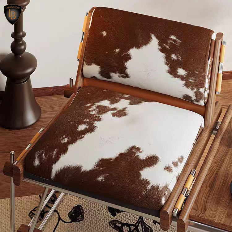 Ronan Cowhide Lounge Chair in Polished Steel - Urban Ashram