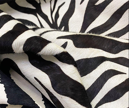 Close-up of zebra-striped fabric with a white background