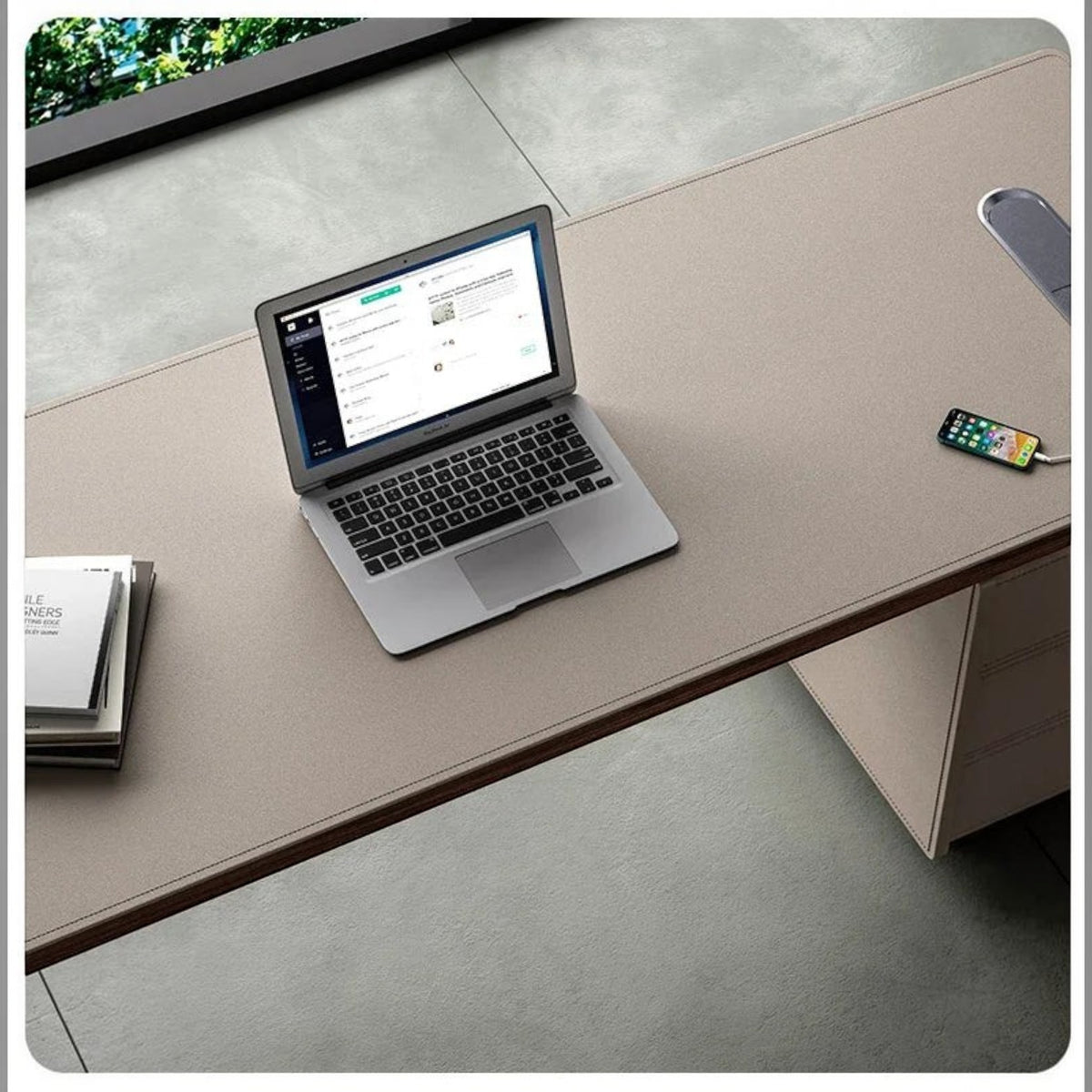 Urban Ashram Arden executive desk in saddle leather with a modern floating silhouette and integrated charging port.
