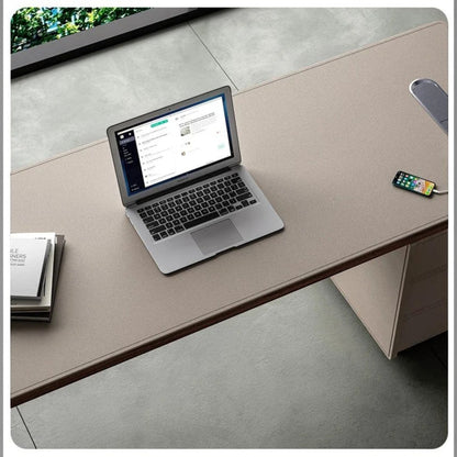 Urban Ashram Arden executive desk in saddle leather with a modern floating silhouette and integrated charging port.