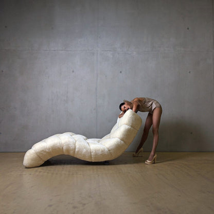 Urban Ashram Cloud 7 Chaise in cream faux mohair with tufted architectural design, shown with a model in a studio.