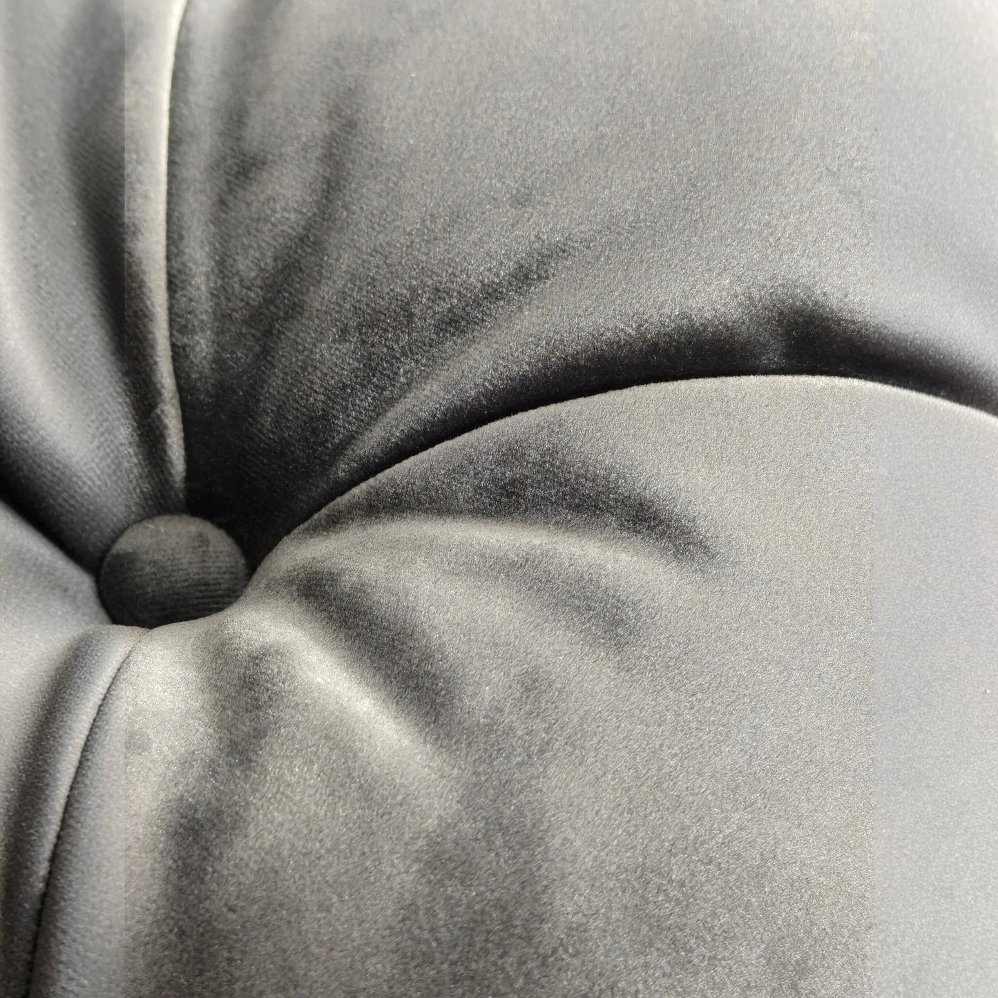 Close-up of Urban Ashram Coco Miralda Chesterfield sofa in smoke grey velvet with hand-sewn button tufting detail.