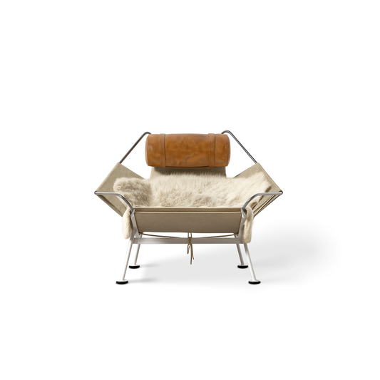 Urban Ashram Flag Halyard Chair with stainless steel frame, flag line, sheepskin throw, and vegan leather headrest.