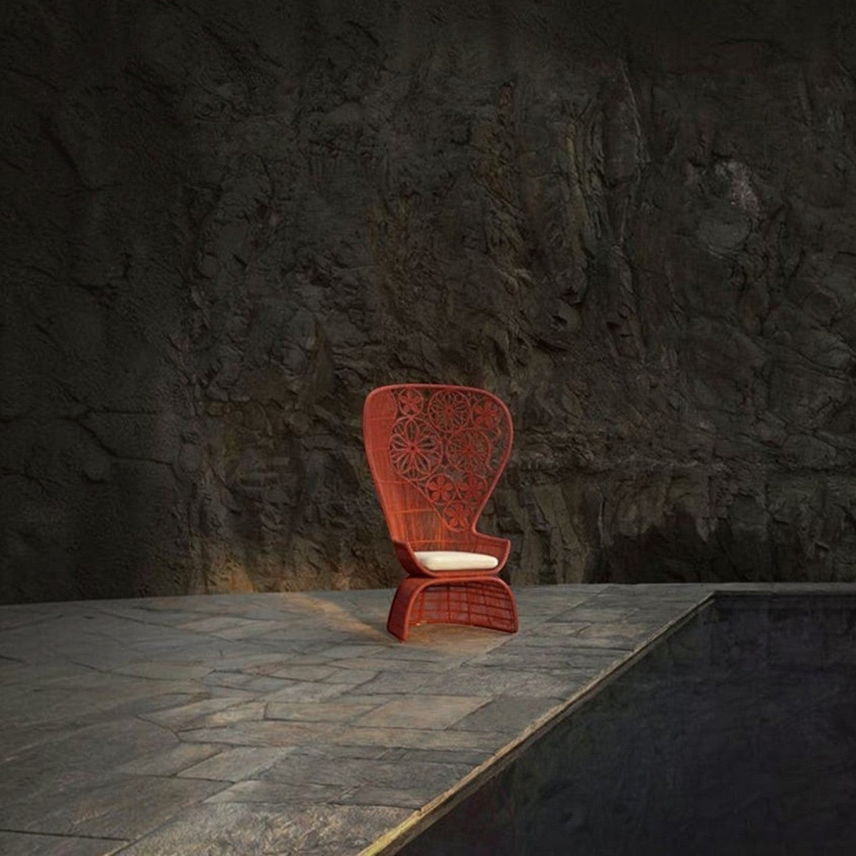 Urban Ashram Genevieve high-back armchair in terracotta with a woven floral backrest and white seat cushion.