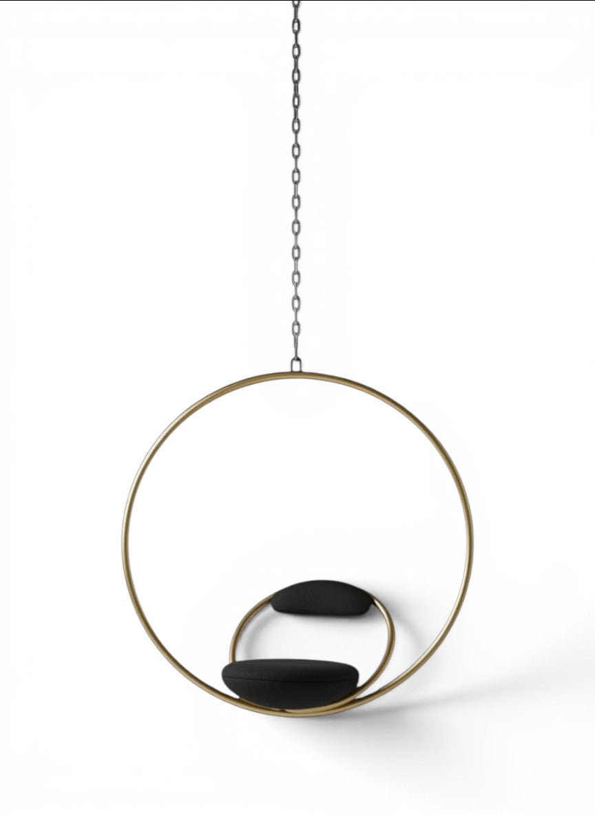 Urban Ashram Hanging Hoop Chair by Lee Broom in brushed brass with red Kvadrat wool upholstery on a hanging chain.