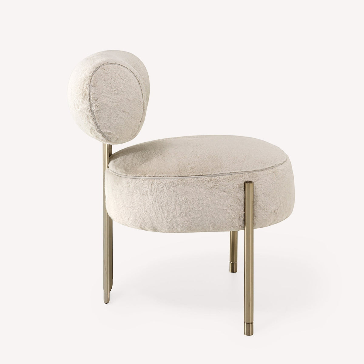 Urban Ashram Verona ivory faux fur accent chair with a sculptural gold-tone steel frame and rounded silhouette.