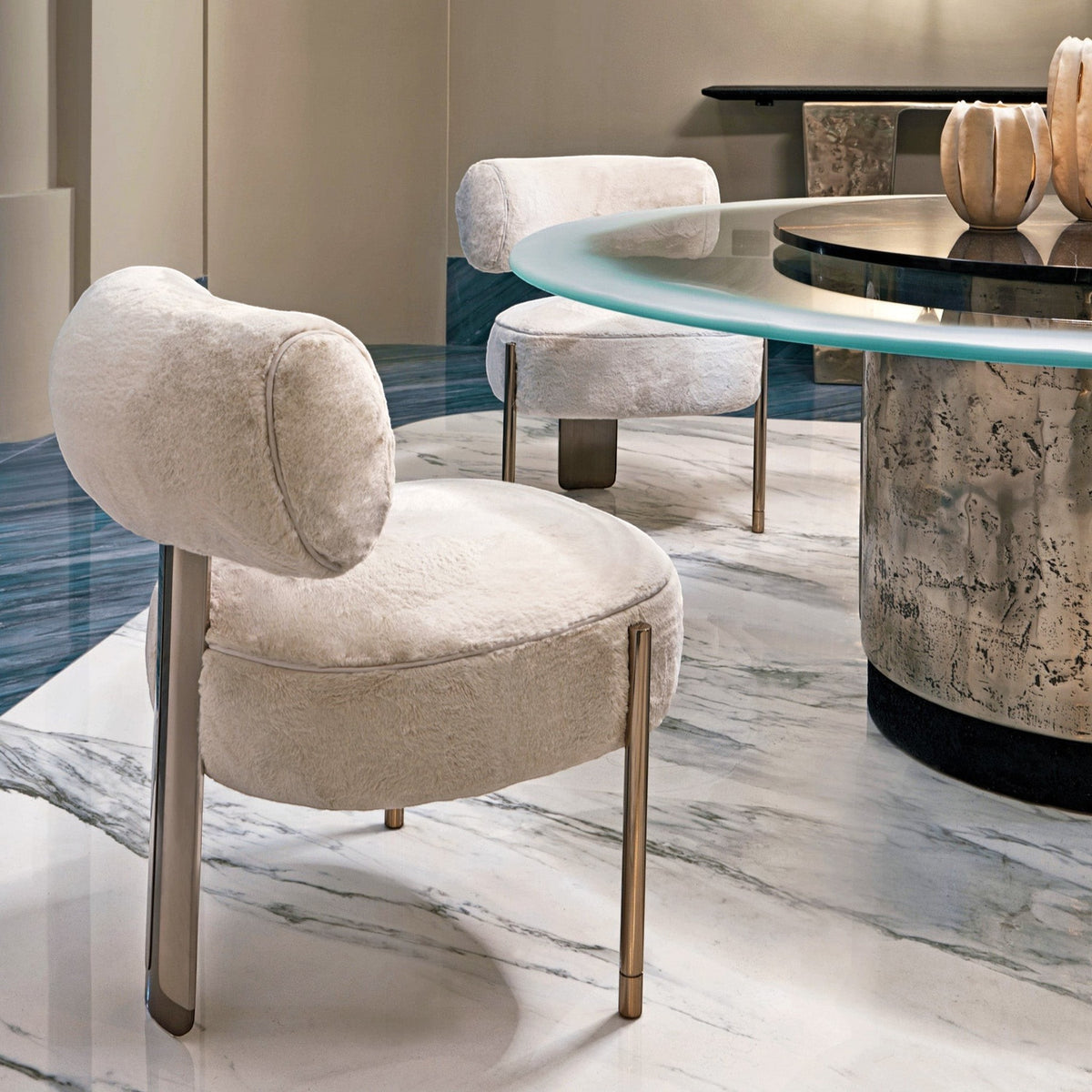 Urban Ashram Verona ivory faux fur dining chair with a sculptural gold steel frame and rounded silhouette