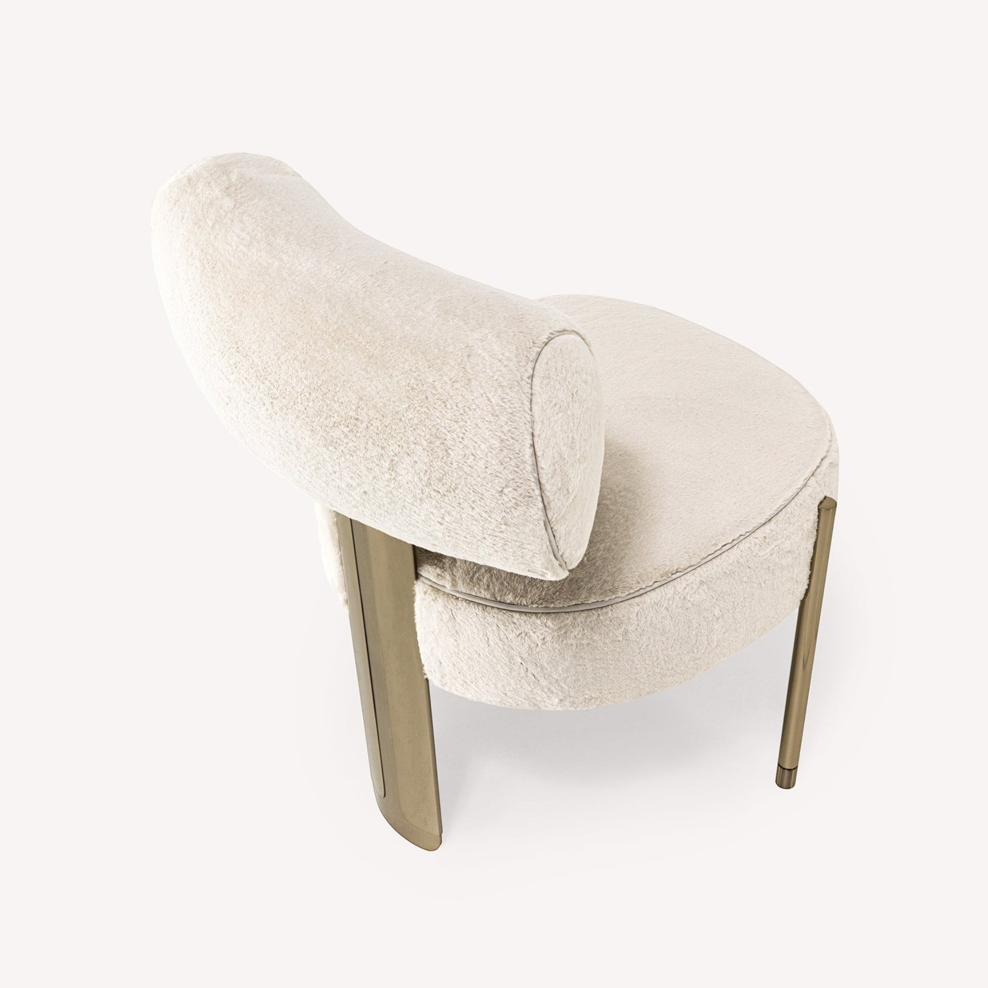 Urban Ashram Verona ivory faux fur chair with a sculptural gold-tone steel frame and rounded silhouette.