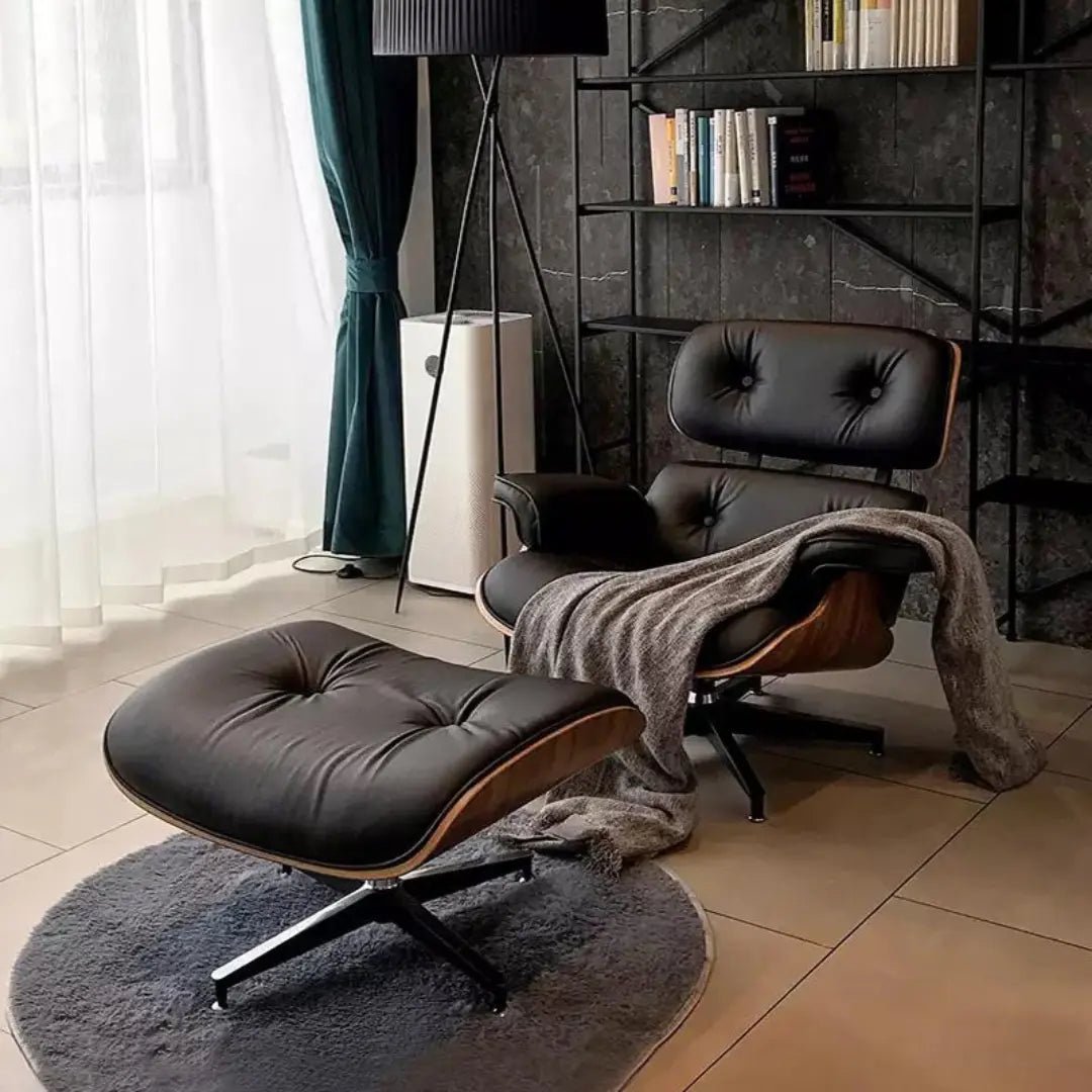 Urban Ashram mid-century modern black leather lounge chair and matching ottoman with wood veneer shell