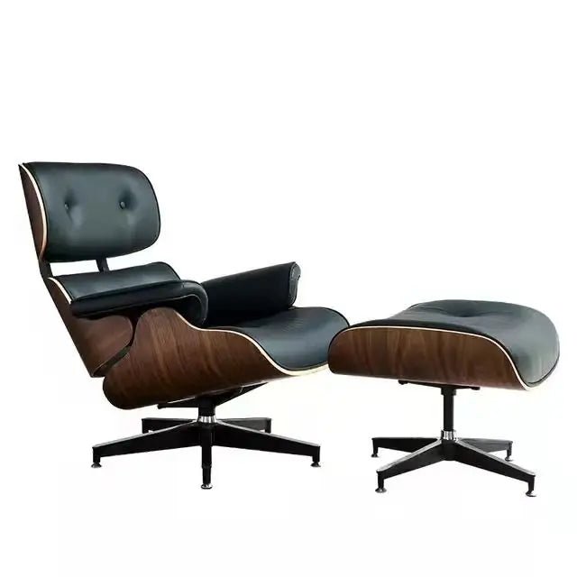 Urban Ashram mid-century lounge chair and ottoman in black leather with dark wood veneer shell and black base.