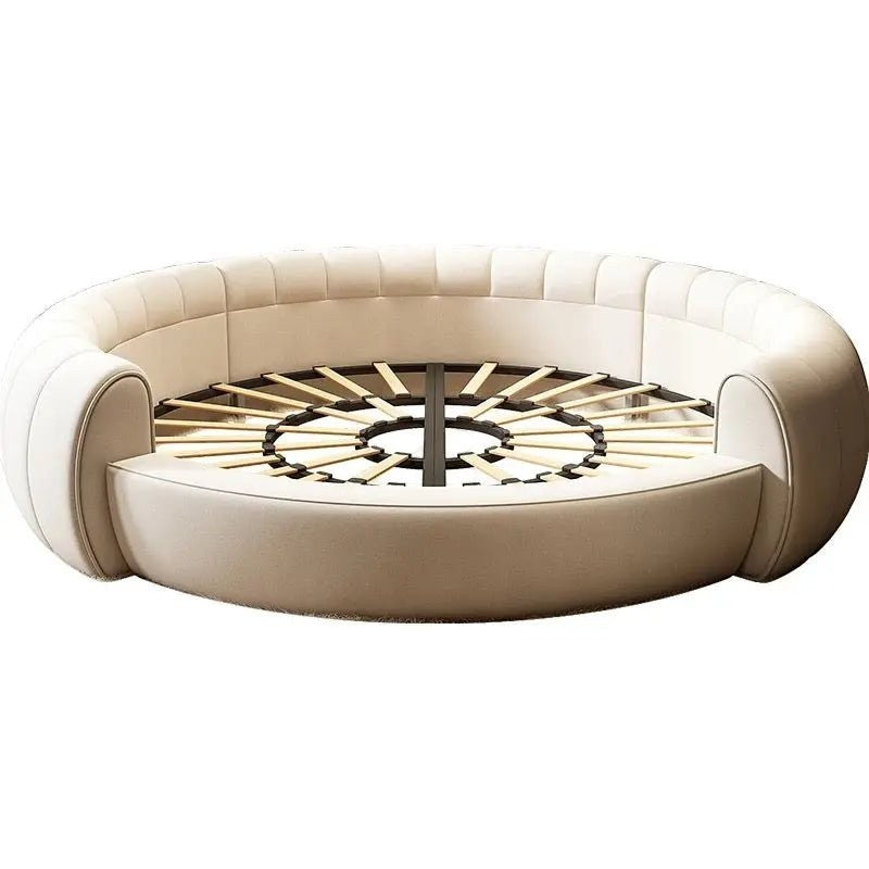 Urban Ashram round Dream Lounger movie bed in cream fabric with a tufted frame and exposed wooden slat base.