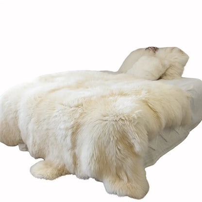 Urban Ashram Dream Lounger movie bed featuring a plush cream-colored faux fur throw on a round cushioned base.