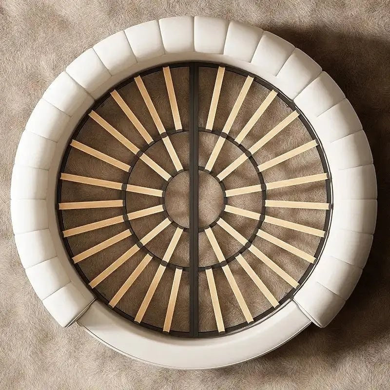 Urban Ashram Dream Lounger round movie bed with cream upholstered frame and wooden slat base, top-down view.
