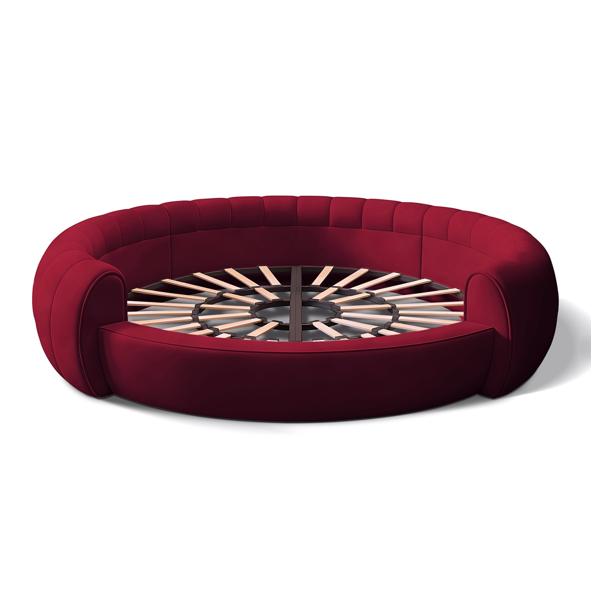 Urban Ashram Dream Lounger round movie bed in deep red velvet with a circular slatted wooden base.
