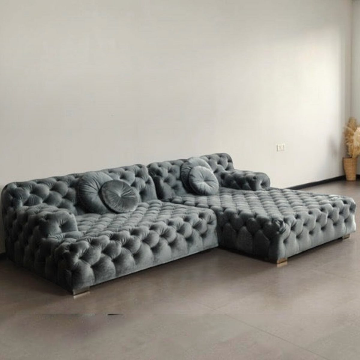 Urban Ashram Coco Miralda smoke grey velvet Chesterfield sofa with deep button tufting and a low-profile design.