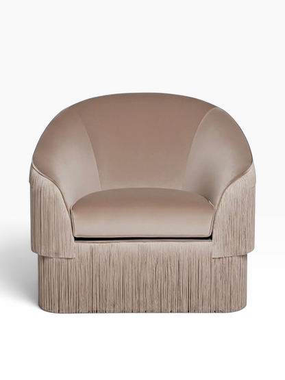 Urban Ashram Atelier fringe armchair in taupe velvet with a curved backrest and elegant cascading fringe detailing.