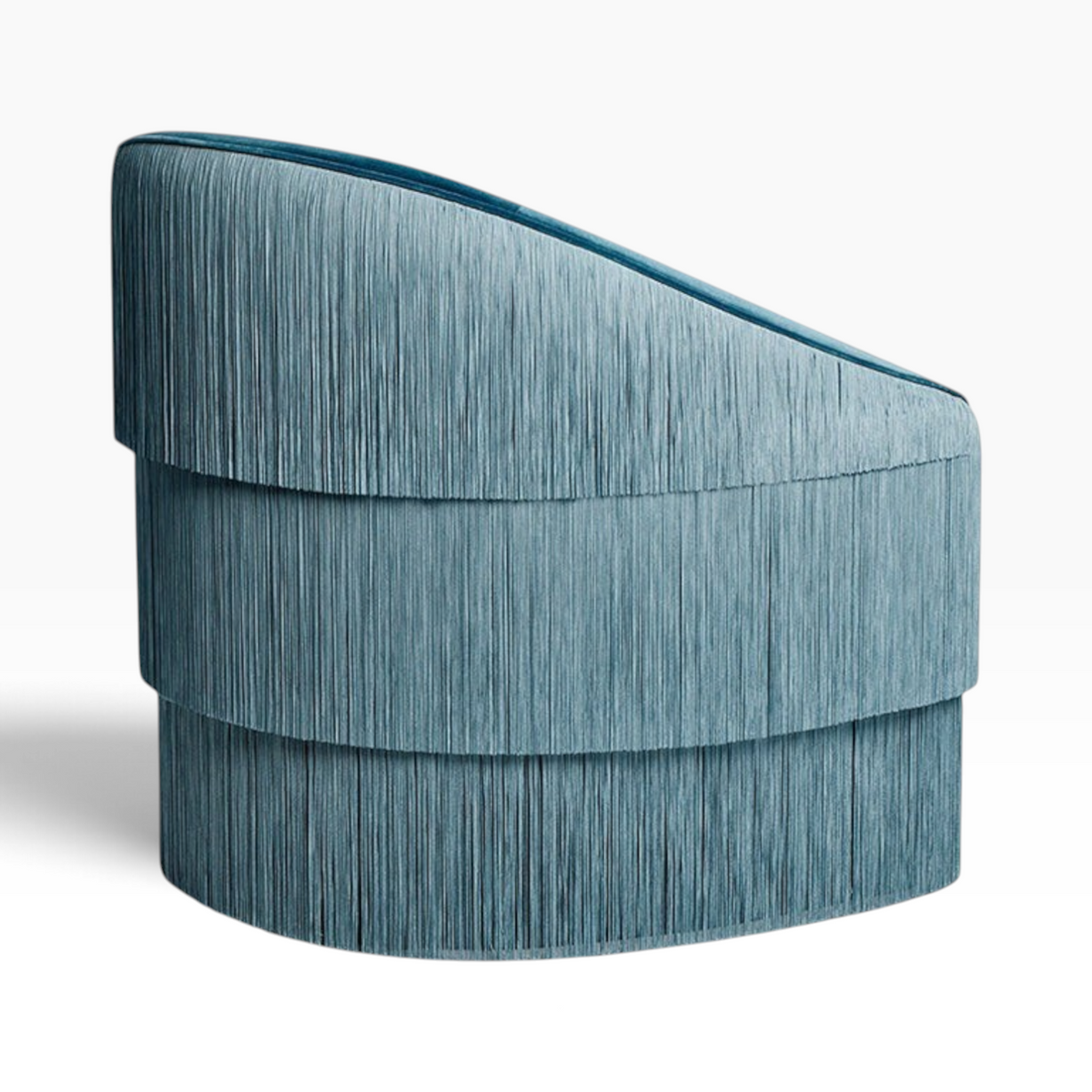 Urban Ashram Atelier fringe armchair in teal velvet with tiered cascading fringe detail and curved backrest.