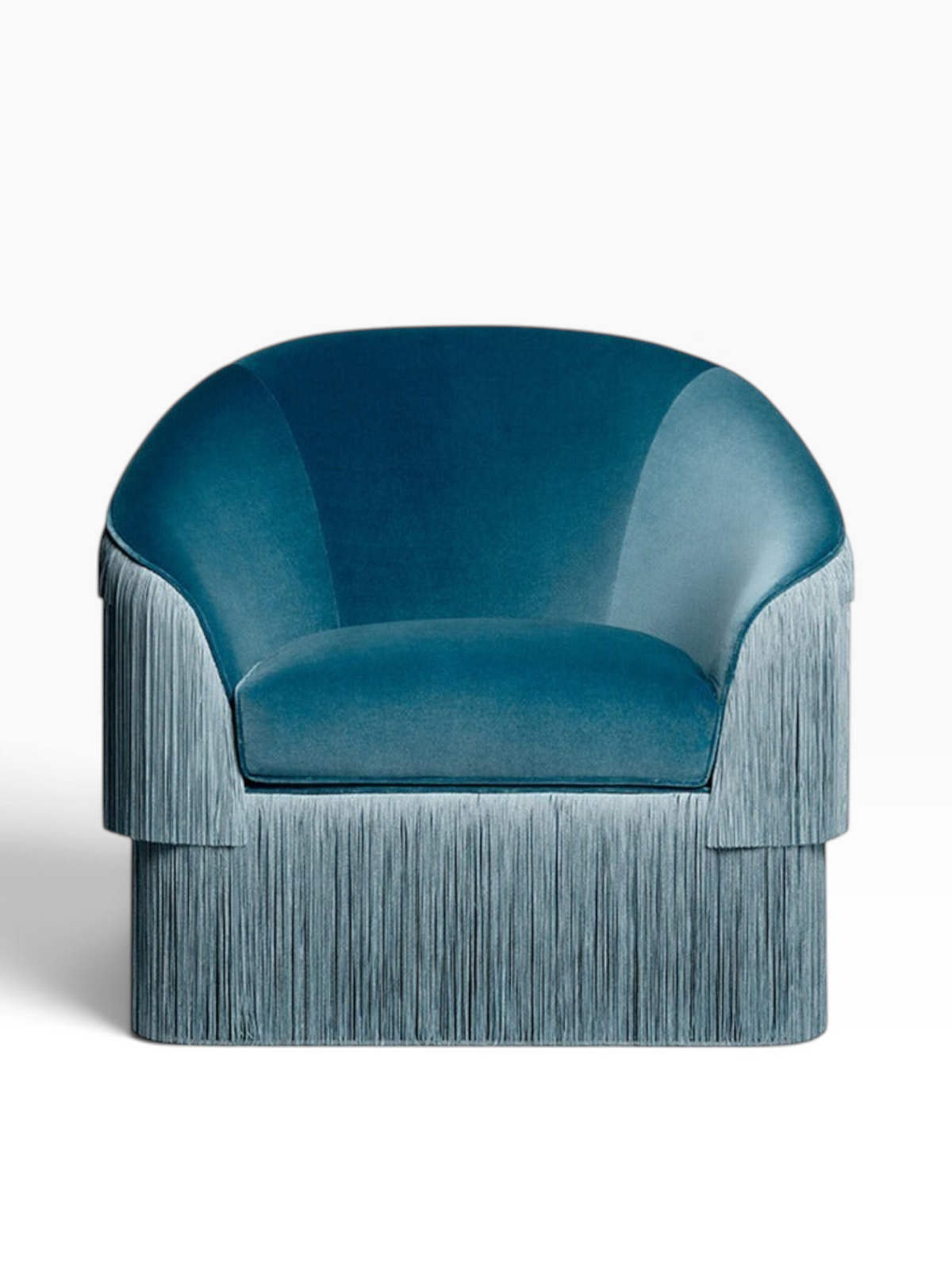 Urban Ashram Atelier fringe armchair in rich teal velvet with a curved backrest and elegant cascading side fringe.