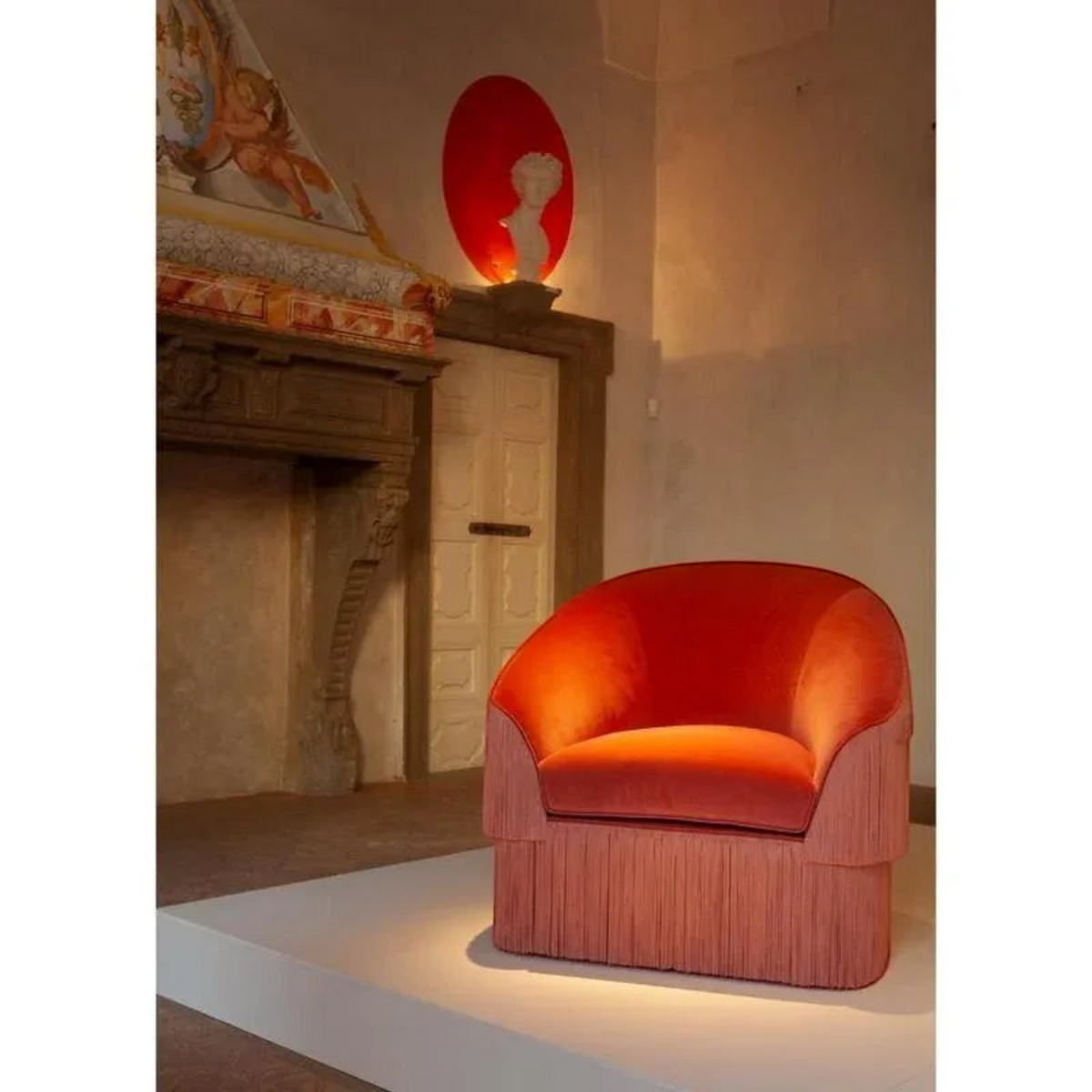 Urban Ashram Atelier fringe armchair in rich teal velvet with a curved backrest and elegant side fringe detailing.