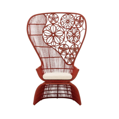 Urban Ashram Genevieve high-back armchair in terracotta with artisanal floral woven backrest and white seat cushion.