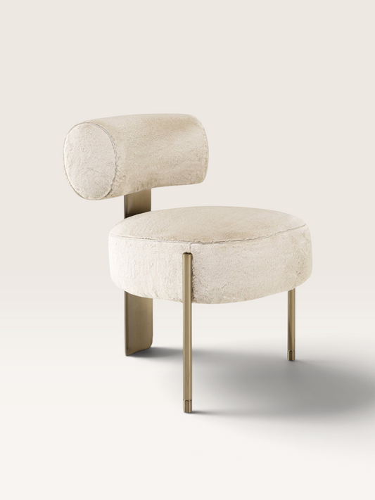 Urban Ashram Verona ivory faux fur chair with a sculptural gold steel frame and rounded silhouette.